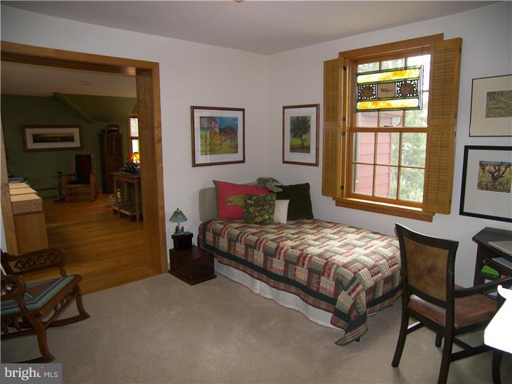 39 Bright Road Hatboro, PA 19040 - Photo 14 of 24 a bedroom with a bed a table and chair