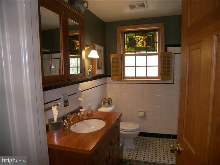 39 Bright Road Hatboro, PA 19040 - Photo 17 of 24 a bathroom with a sink a toilet and a mirror