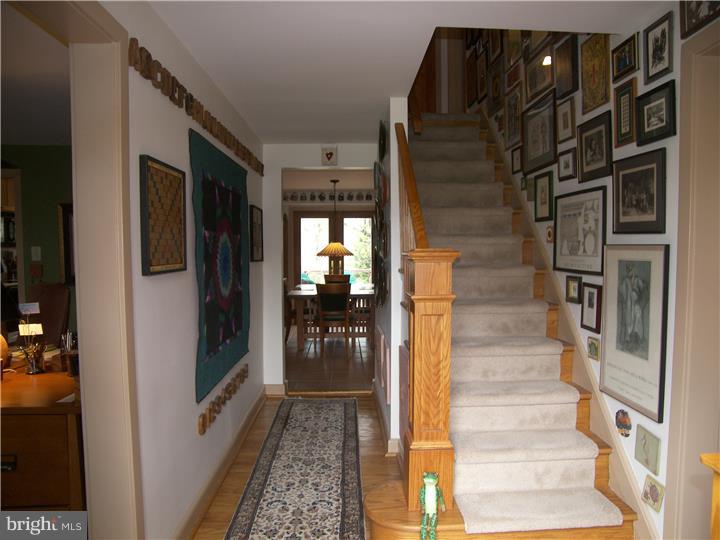 39 Bright Road Hatboro, PA 19040 - Photo 3 of 24 a view of a hallway with wooden floor and living room