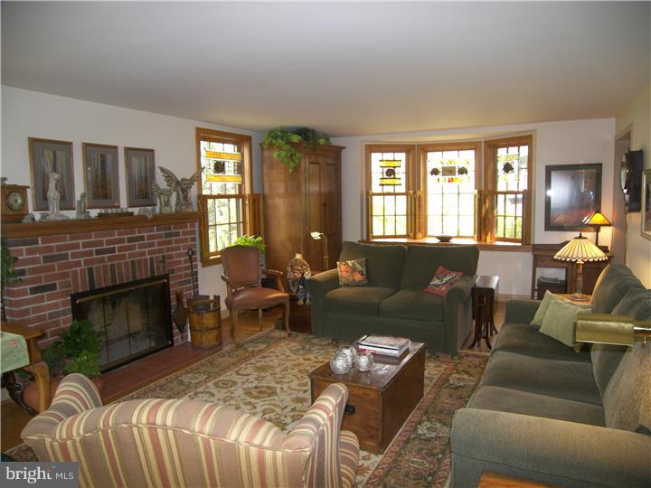 39 Bright Road Hatboro, PA 19040 - Photo 4 of 24 a living room with furniture fireplace and window