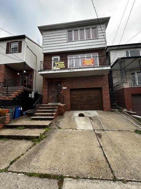 622 Liberty Avenue, Unit 1 Jersey City, NJ 07307 - Photo 3 of 14 a front view of a house with a garage