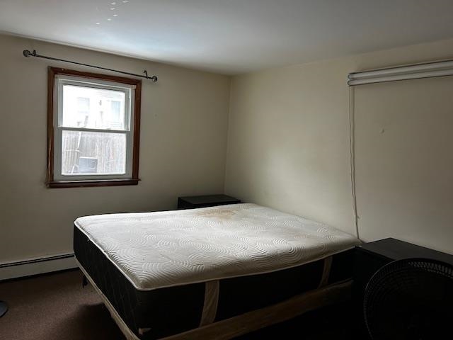 622 Liberty Avenue, Unit 1 Jersey City, NJ 07307 - Photo 4 of 14 a bed sitting in a bedroom next to a window