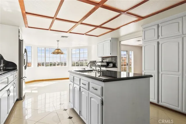 a kitchen with stainless steel appliances granite countertop a sink and cabinets