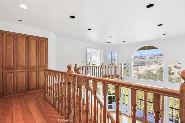 a view of staircase with rug