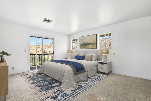 a bed room with a bed and a window