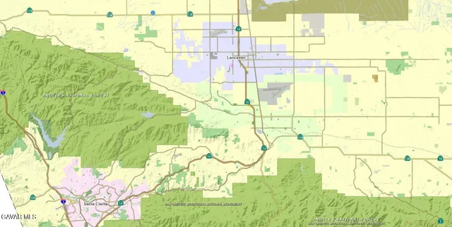 a bathroom with a sink shower and a mirror