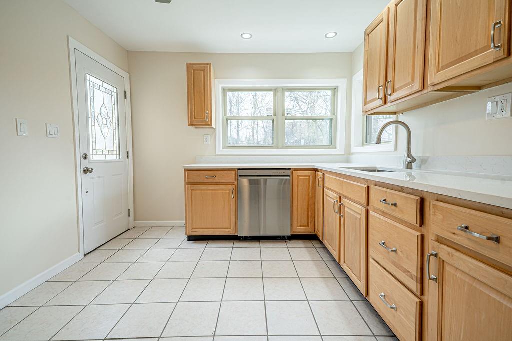 1435 Morrow Road Pittsburgh, PA 15241 - Photo 3 of 26 a kitchen with white cabinets appliances and a window