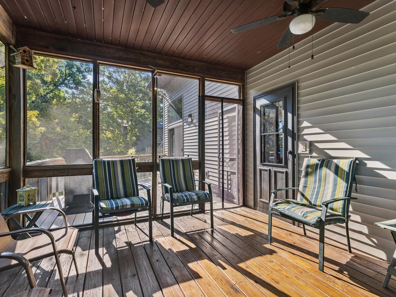 1 Lake Summerset Road Lake Summerset, IL 61019 - Photo 20 of 41 a view of a patio with chairs and floor to ceiling window with wooden floor