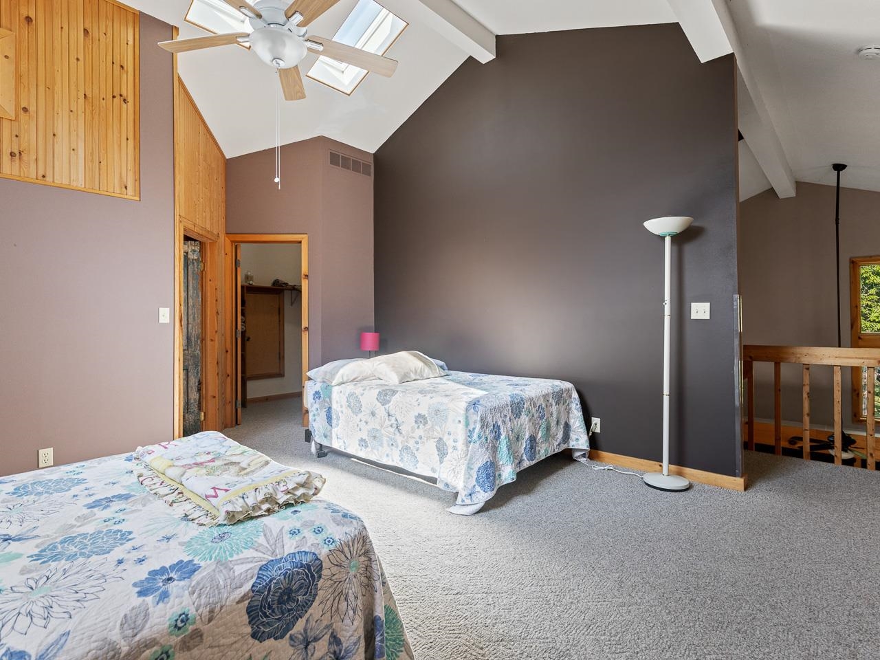 1 Lake Summerset Road Lake Summerset, IL 61019 - Photo 23 of 41 a bedroom with a bed and a chandelier