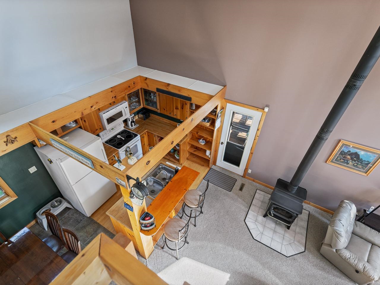 1 Lake Summerset Road Lake Summerset, IL 61019 - Photo 24 of 41 an aerial view of a backyard with table and chairs with wooden floor