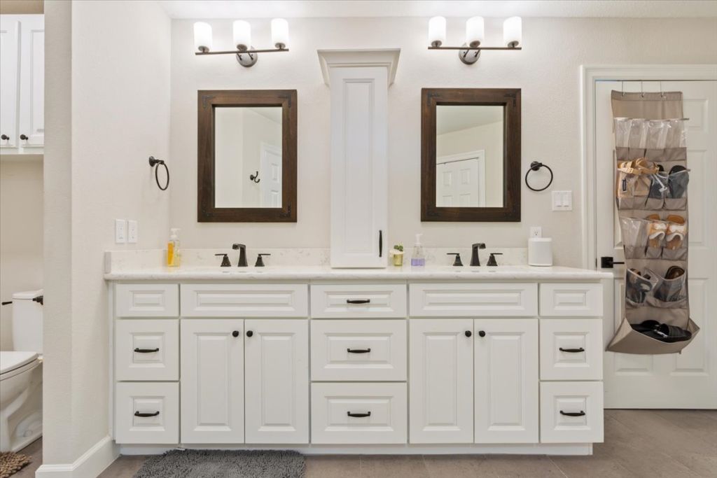 190 Young Ranch Road Georgetown, TX 78633 - Photo 14 of 40 Bathroom with toilet and double vanity