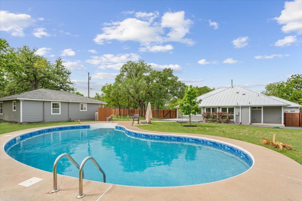 190 Young Ranch Road Georgetown, TX 78633 - Photo 16 of 40 View of pool featuring patio surround and an outdoor structure
