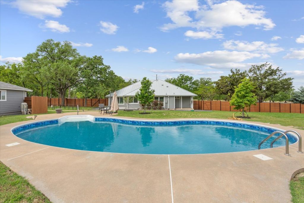 190 Young Ranch Road Georgetown, TX 78633 - Photo 17 of 40 View of swimming pool featuring patio surround and a fenced backyard