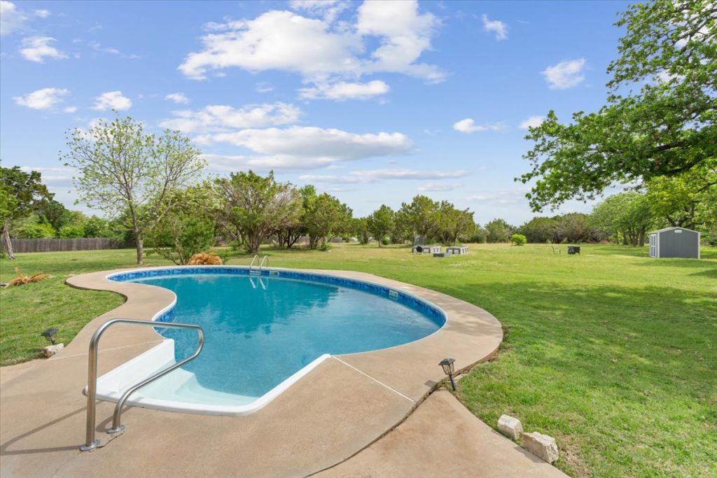 190 Young Ranch Road Georgetown, TX 78633 - Photo 18 of 40 Swimming pool with a yard and a patio