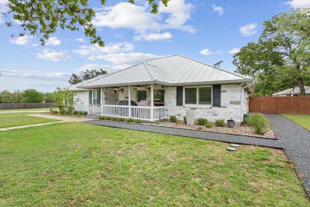 190 Young Ranch Road Georgetown, TX 78633 - Photo 28 of 40 View of front of home featuring covered porch, a standing seam roof, and stone siding