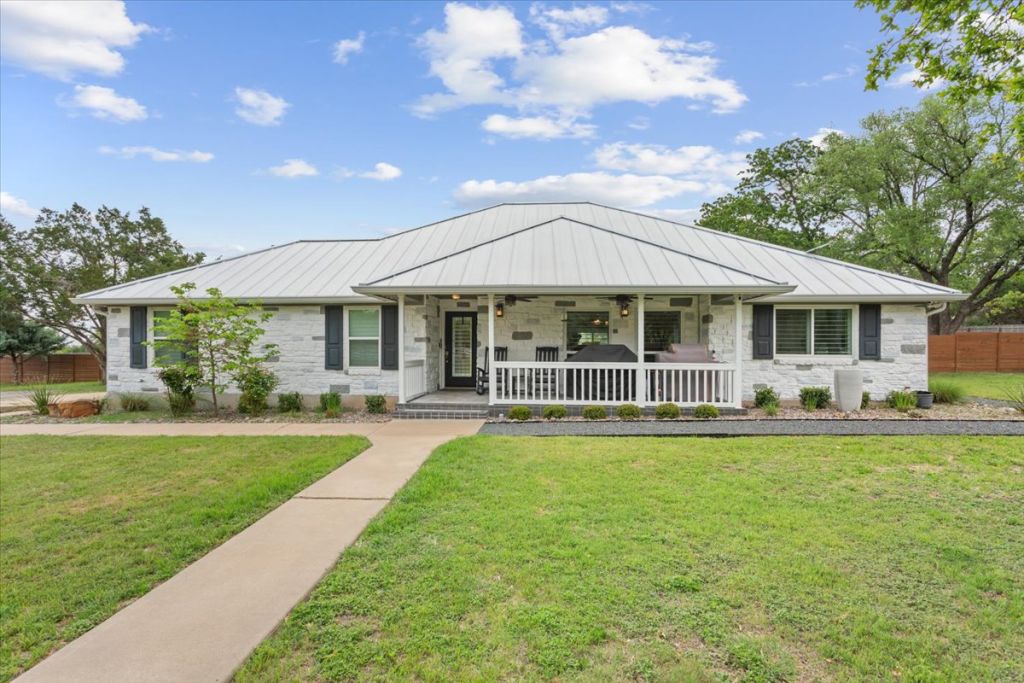 190 Young Ranch Road Georgetown, TX 78633 - Photo 30 of 40 Single story home featuring a porch, stone siding, and a standing seam roof
