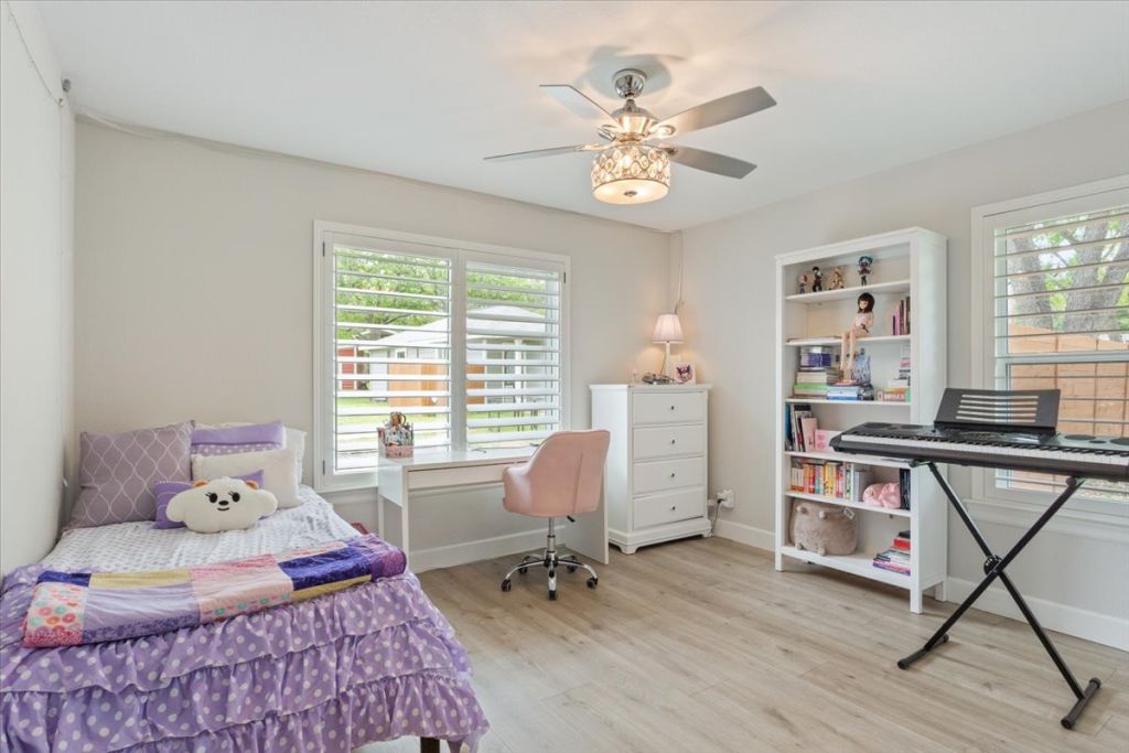 190 Young Ranch Road Georgetown, TX 78633 - Photo 32 of 40 Bedroom featuring light wood-style floors, ceiling fan, and multiple windows