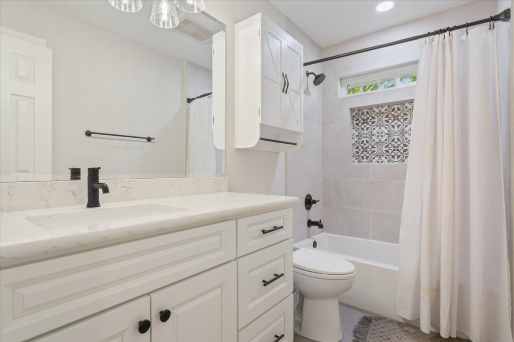 190 Young Ranch Road Georgetown, TX 78633 - Photo 33 of 40 Full bath with vanity and shower / tub combo with curtain