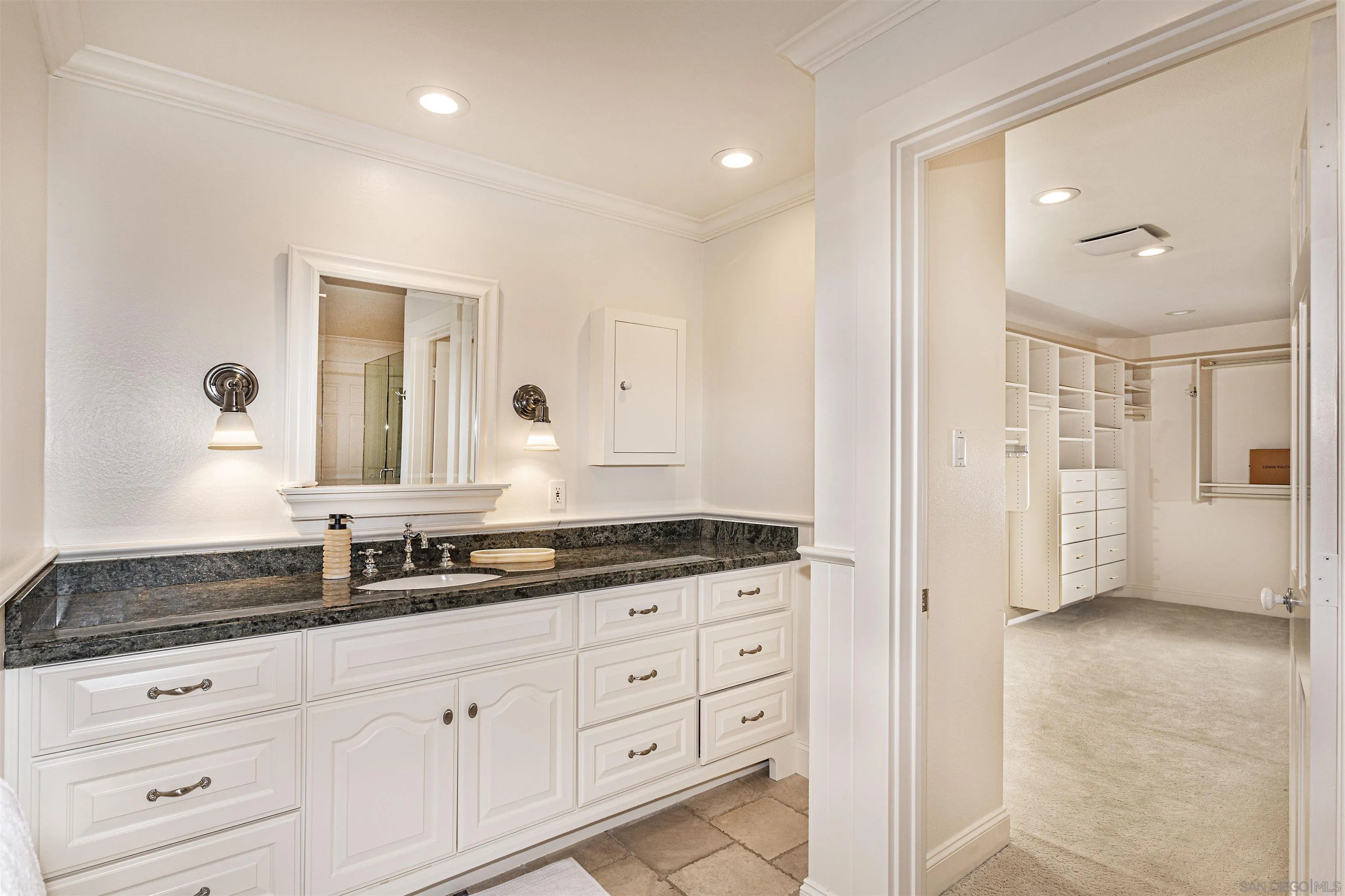 6571 Mimulus Rancho Santa Fe, CA 92067 - Photo 21 of 55 a spacious bathroom with double sink and a mirror
