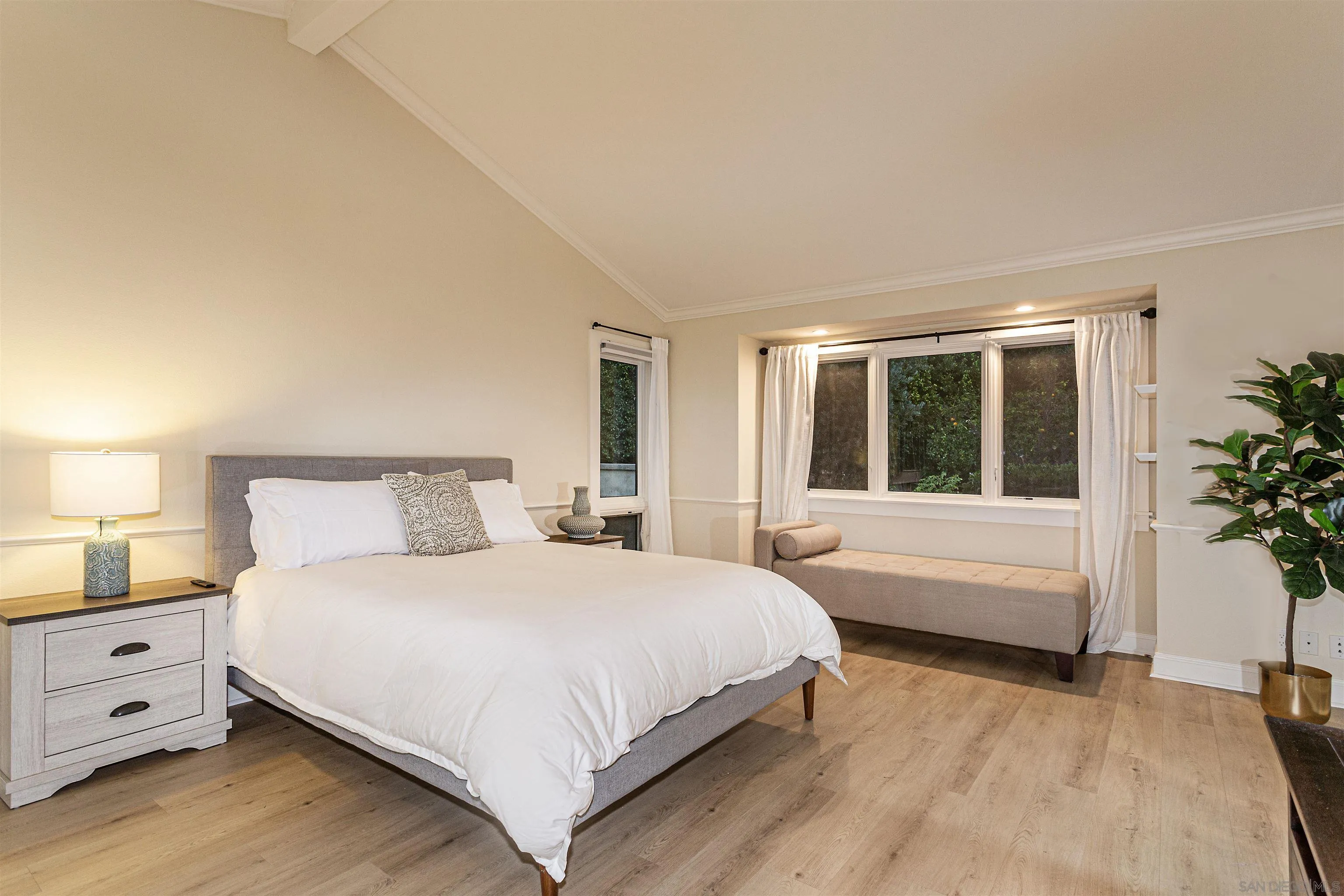 6571 Mimulus Rancho Santa Fe, CA 92067 - Photo 26 of 55 a bedroom with a large bed and a large window