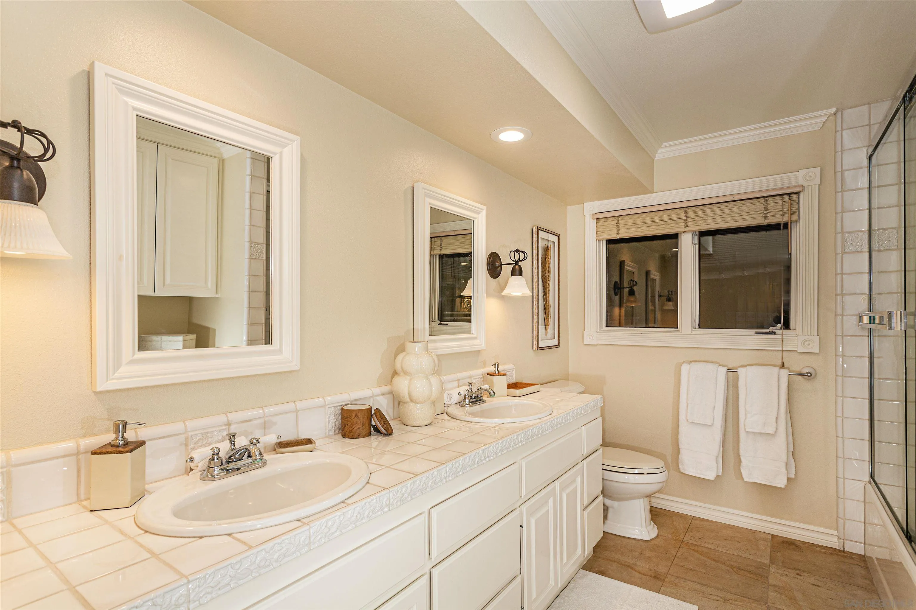 6571 Mimulus Rancho Santa Fe, CA 92067 - Photo 30 of 55 a bathroom with a granite countertop sink mirror and a toilet