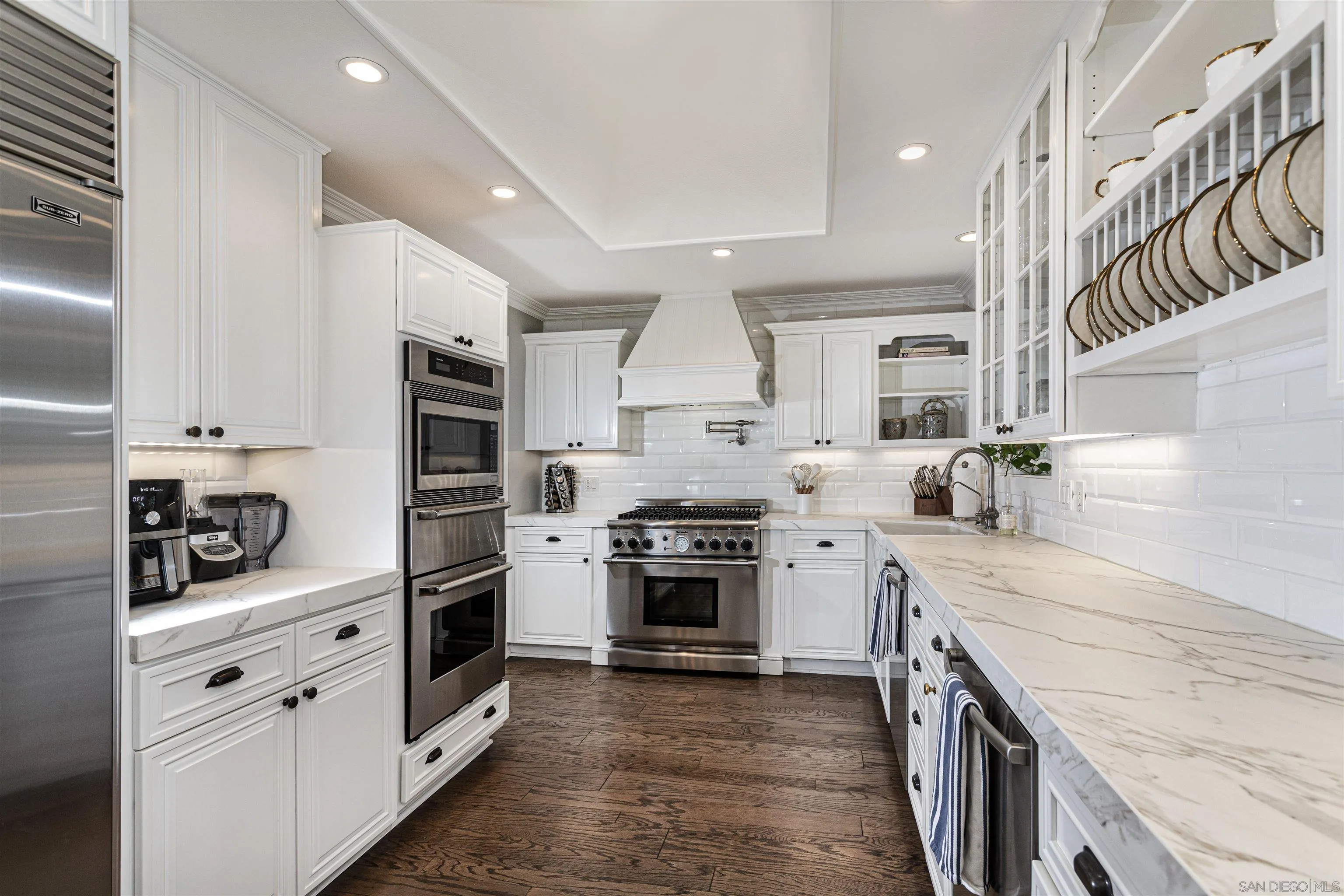 6571 Mimulus Rancho Santa Fe, CA 92067 - Photo 45 of 55 a kitchen with stainless steel appliances granite countertop a sink and cabinets