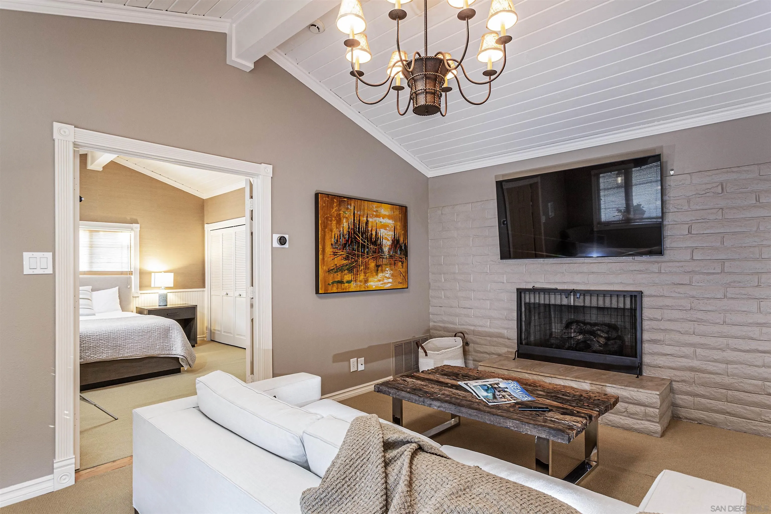 6571 Mimulus Rancho Santa Fe, CA 92067 - Photo 50 of 55 a living room with furniture a fireplace and a flat screen tv