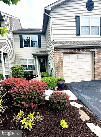 a front view of house and yard with seating space