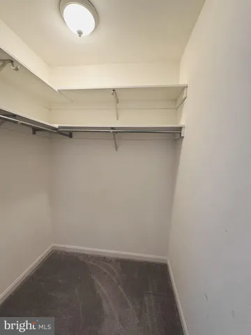 a bathroom with a sink a toilet a mirror and shower