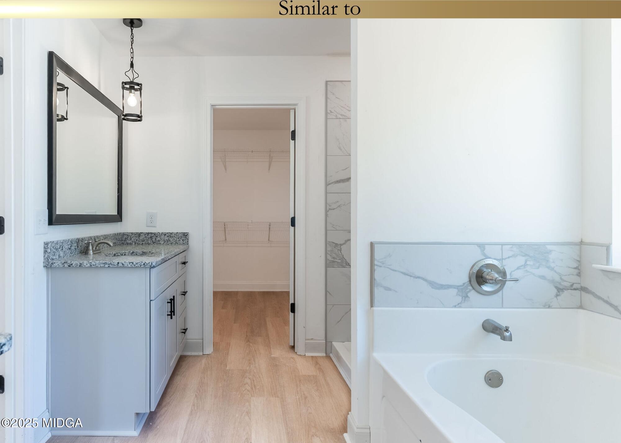 106 Maries Gdn Trail Macon, GA 31216 - Photo 14 of 19 a bathroom with a tub sink and mirror