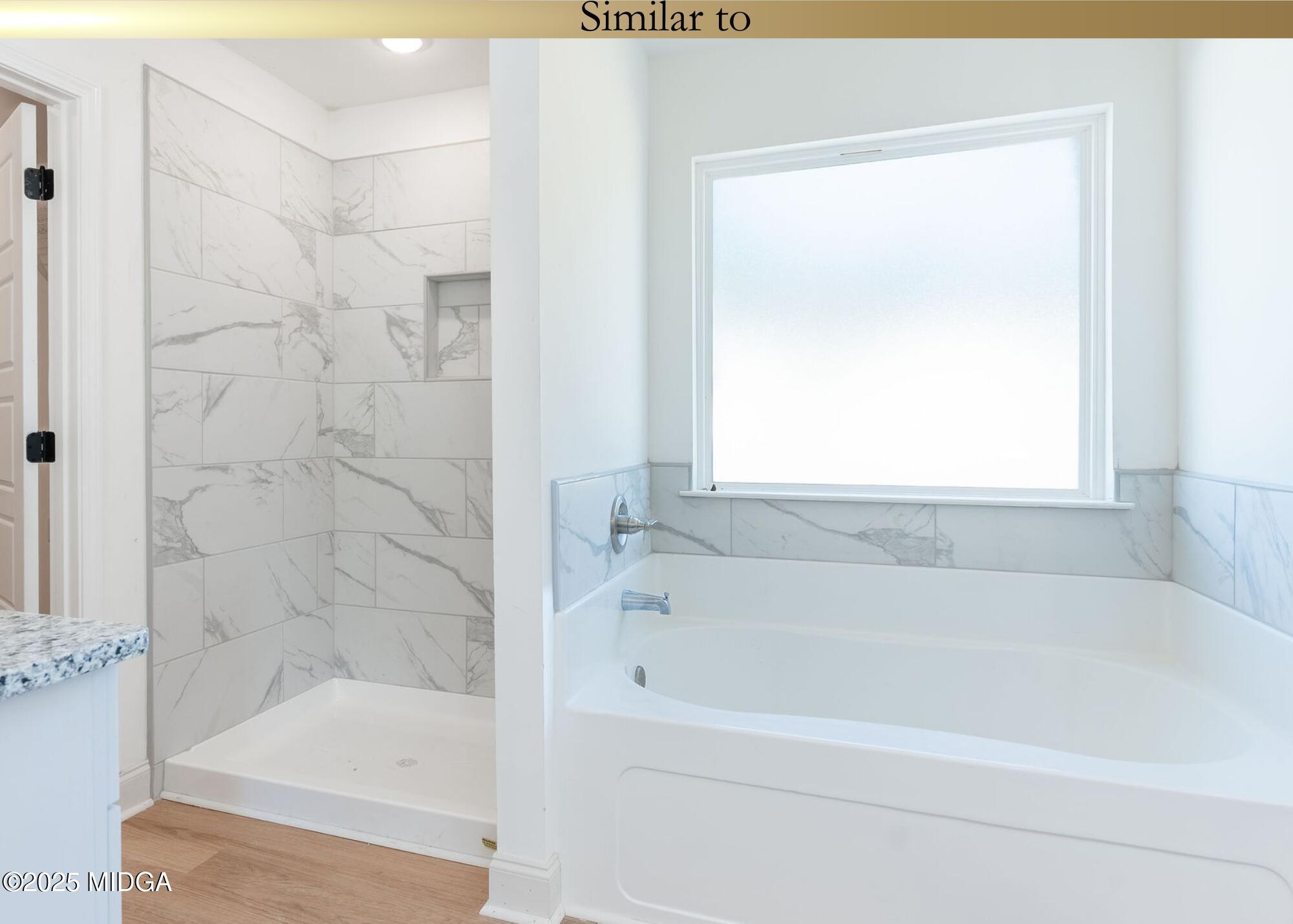 106 Maries Gdn Trail Macon, GA 31216 - Photo 15 of 19 a bathroom with a bathtub and a shower