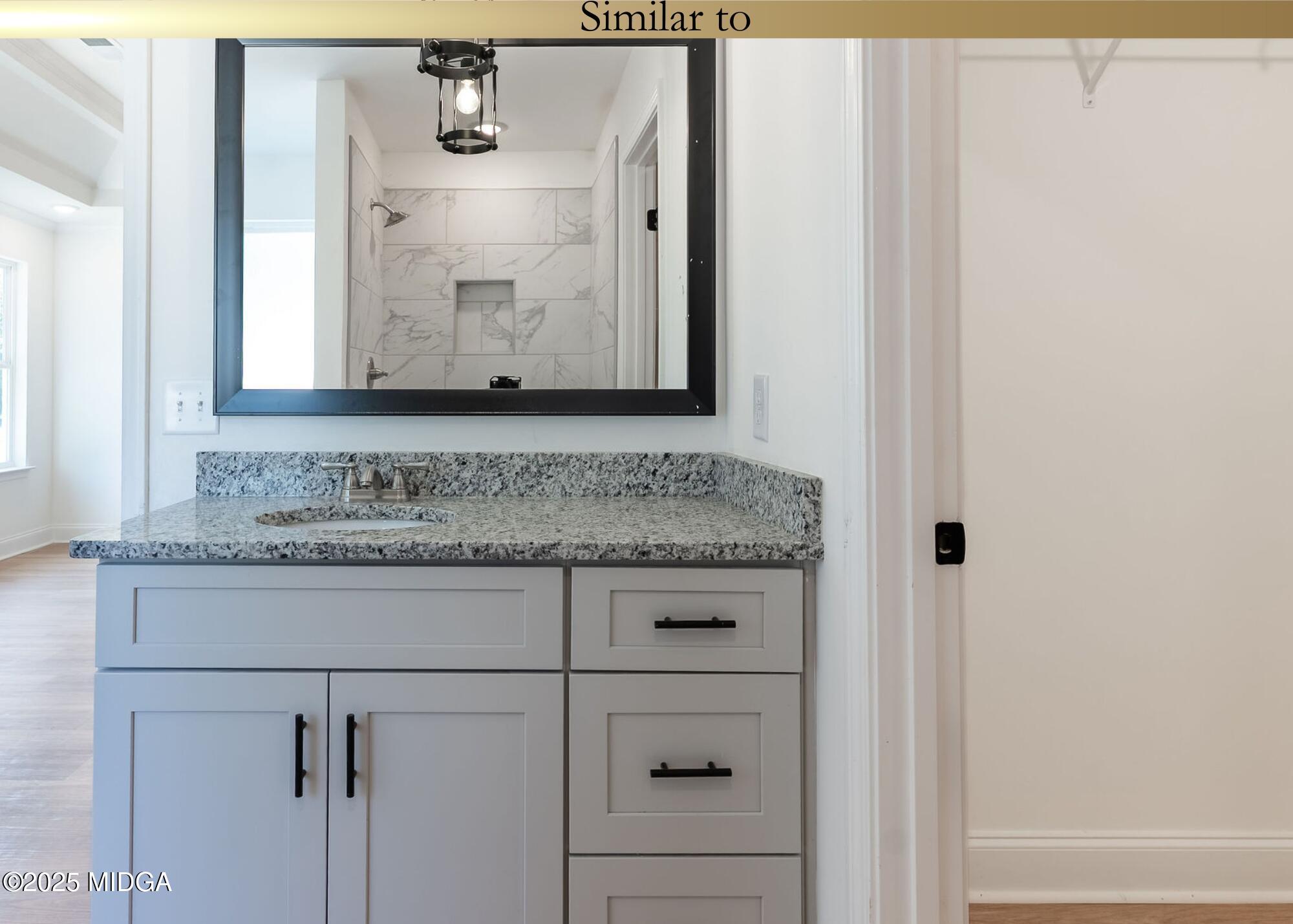 106 Maries Gdn Trail Macon, GA 31216 - Photo 16 of 19 a view of bathroom with granite countertop cabinets