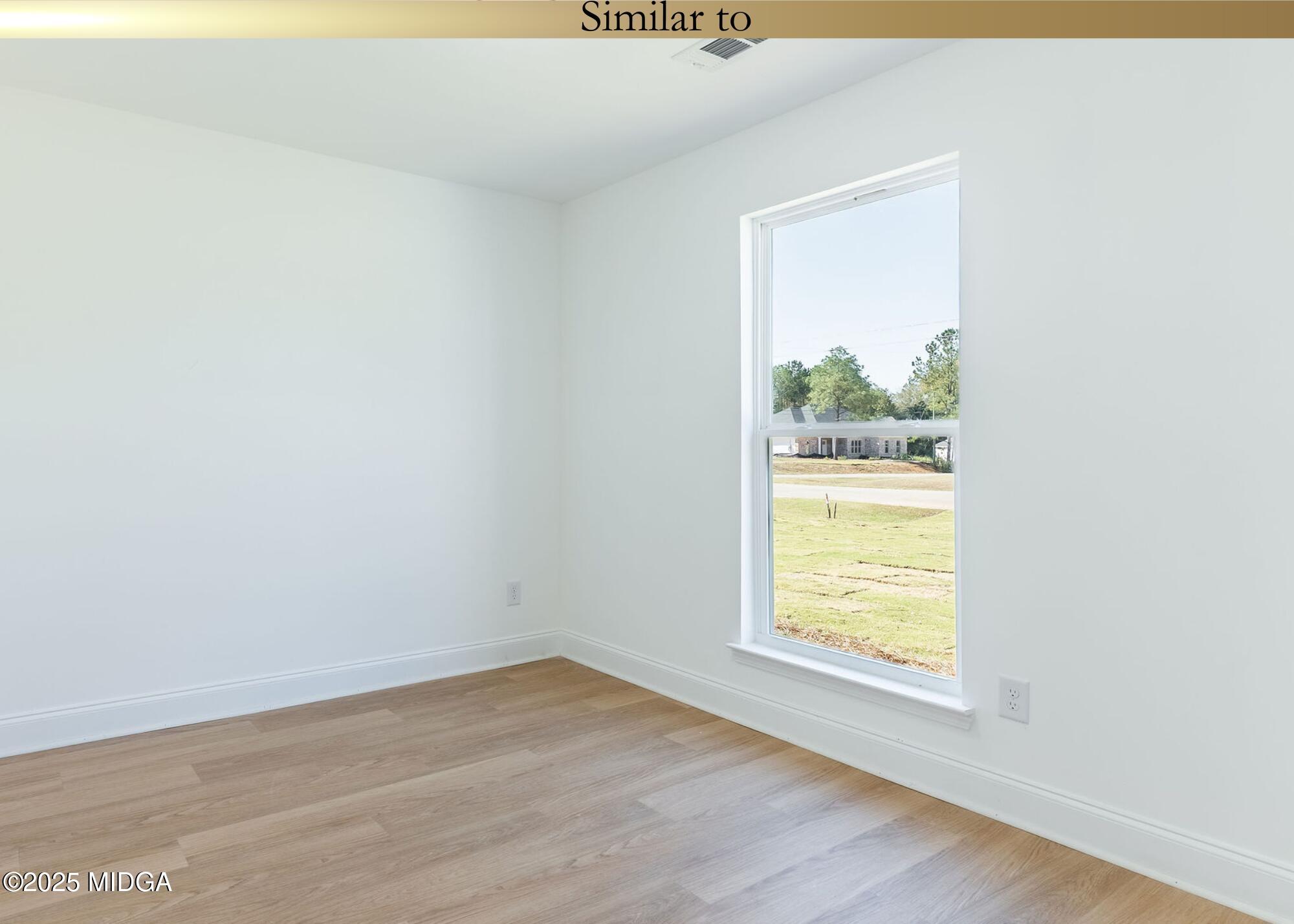 106 Maries Gdn Trail Macon, GA 31216 - Photo 18 of 19 an empty room with wooden floor and windows