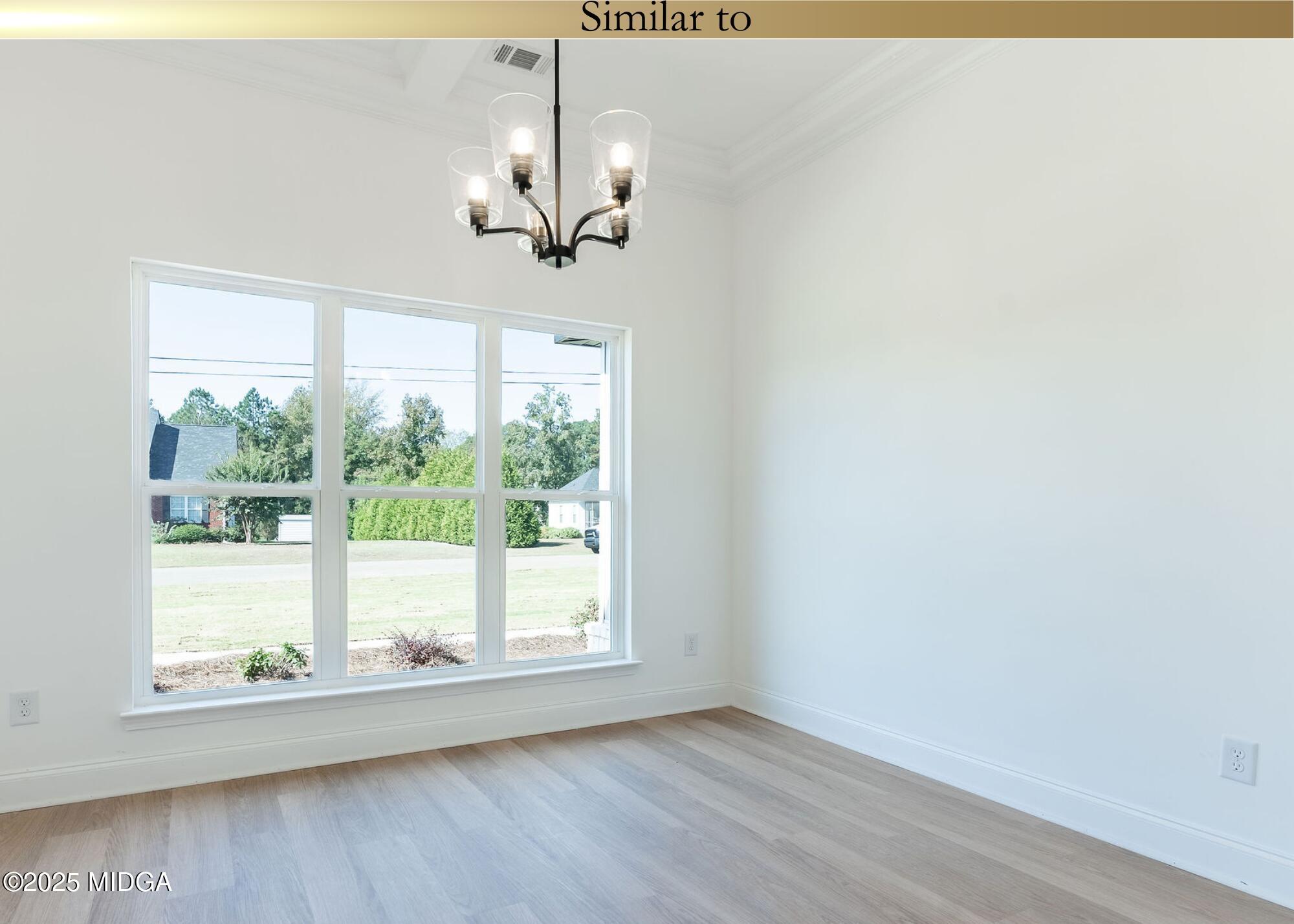 106 Maries Gdn Trail Macon, GA 31216 - Photo 3 of 19 a view of empty room with wooden floor fan and window
