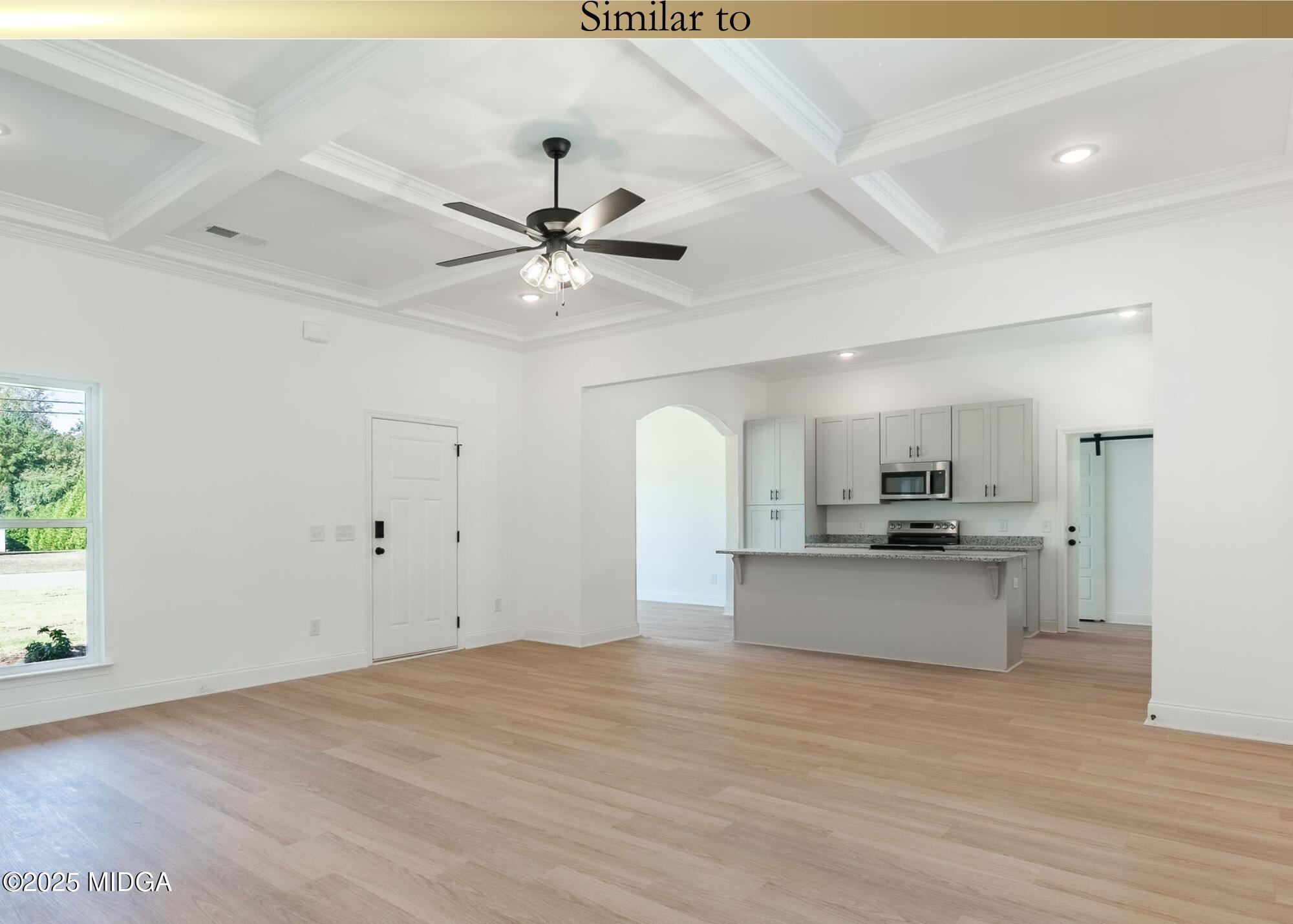 106 Maries Gdn Trail Macon, GA 31216 - Photo 8 of 19 a large kitchen with stainless steel appliances a large counter top a chandelier and a view of kitchen