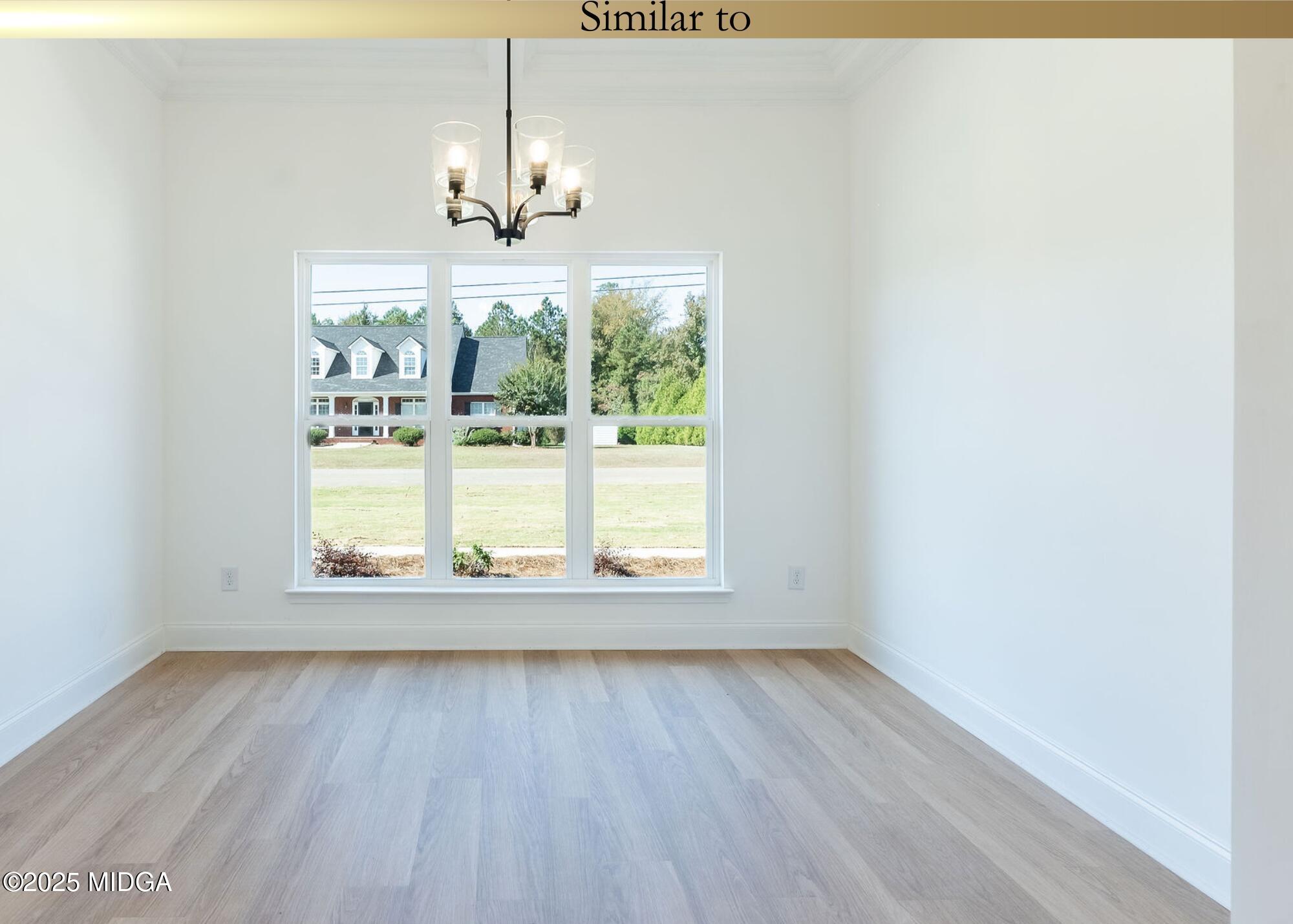 106 Maries Gdn Trail Macon, GA 31216 - Photo 10 of 19 an empty room with wooden floor and outdoor view