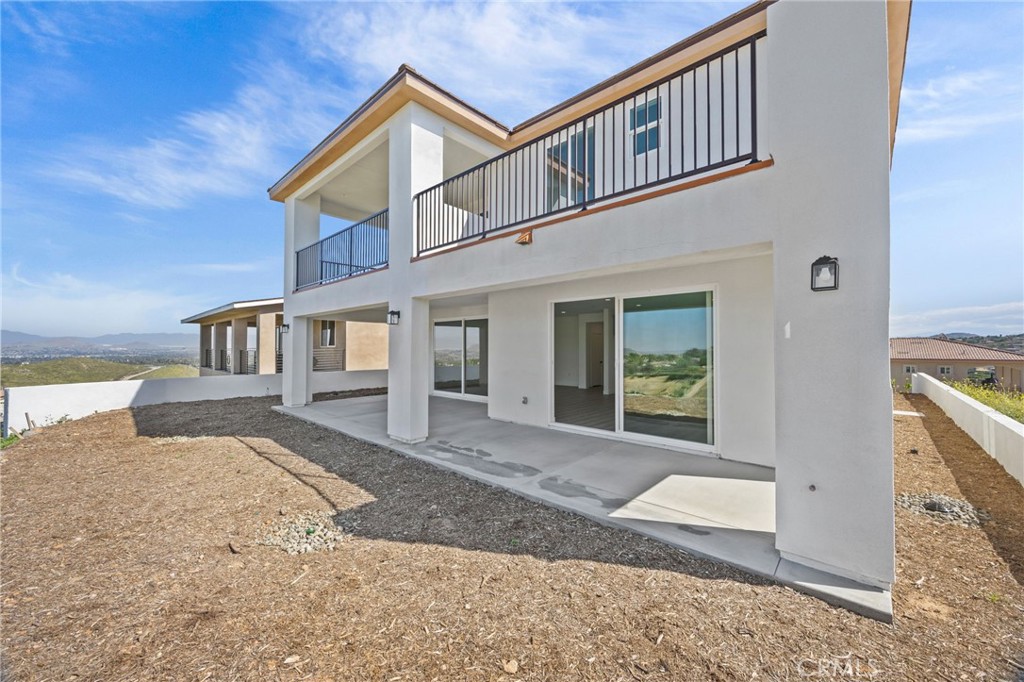 16765 La Bella Villa Riverside, CA 92503 - Photo 22 of 27 a front view of a house with a yard outdoor seating and barbeque oven