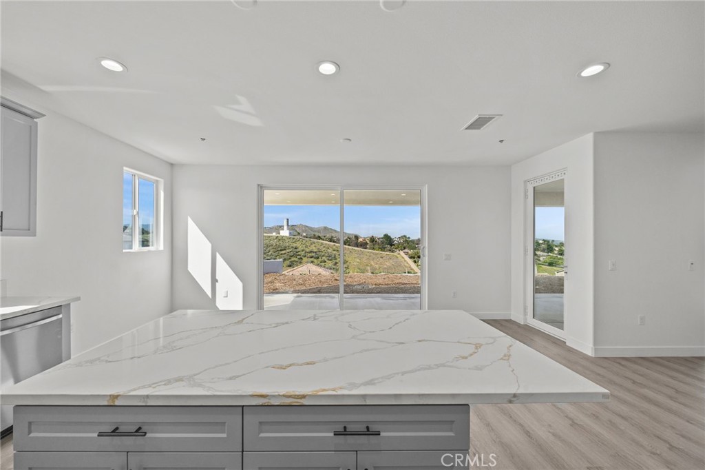 16765 La Bella Villa Riverside, CA 92503 - Photo 9 of 27 a view of a livingroom with wooden floor and a large window
