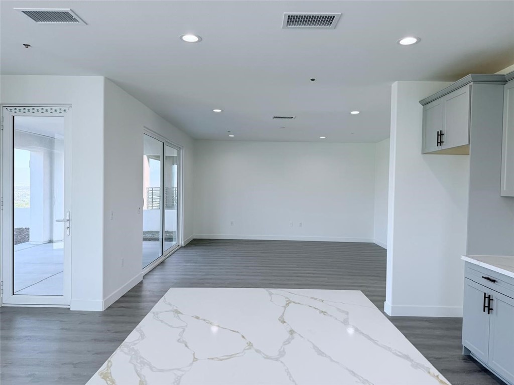 16765 La Bella Villa Riverside, CA 92503 - Photo 10 of 27 a view of hallway with a window and wooden floor