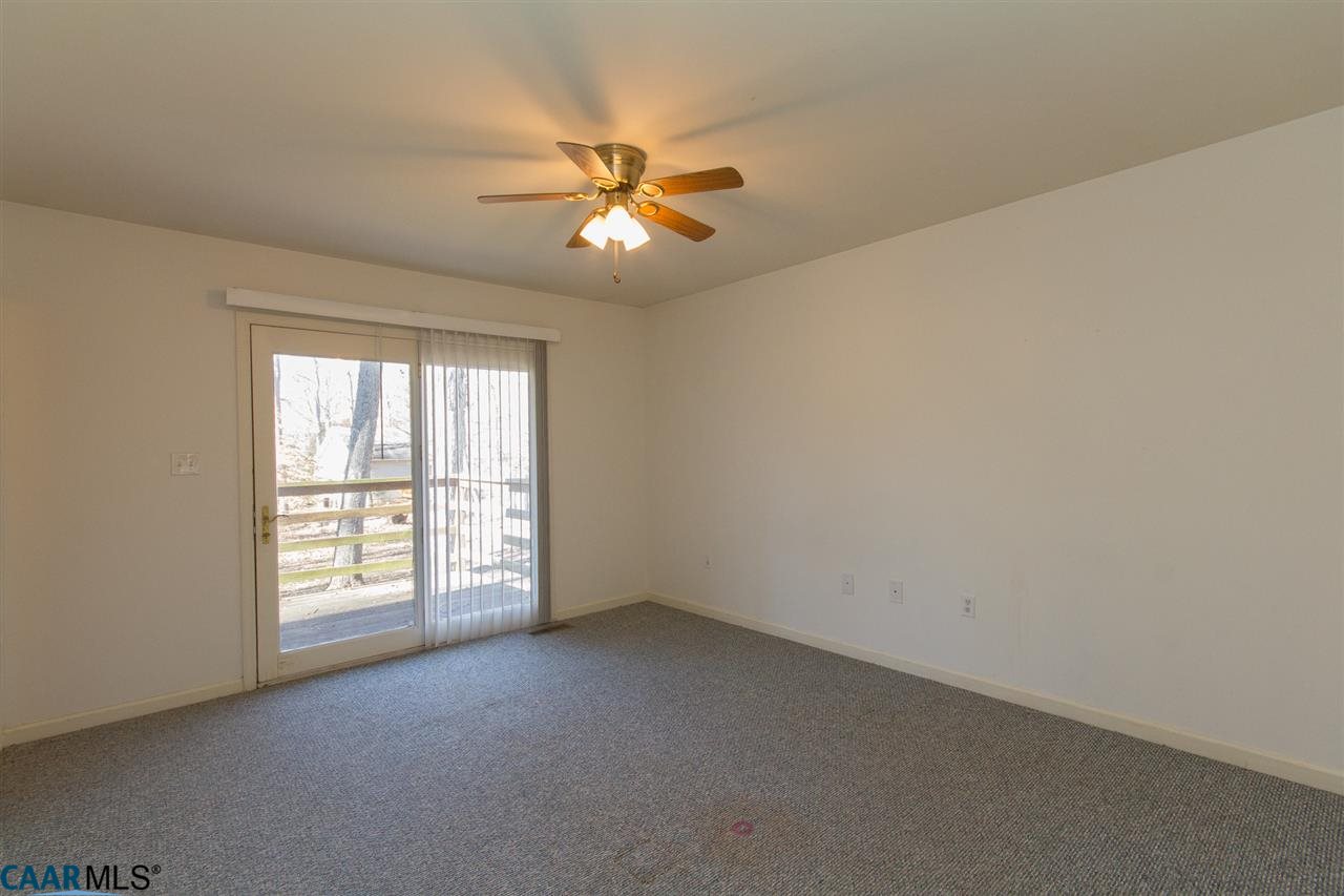 24 Hardwood Road Palmyra, VA 22963 - Photo 10 of 23 Spacious Master Bedroom features Private Walk-out to Back Deck & Yard
