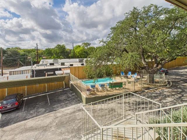 a view of a patio with couches chairs and a fire pit
