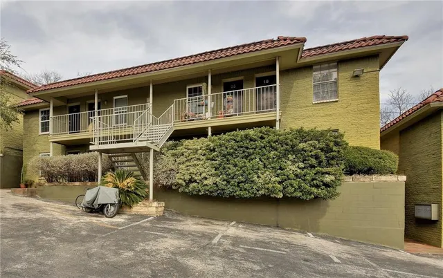 a view of a wooden house with large windows