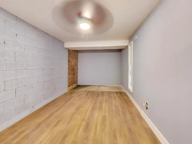 a view of room with wooden floor