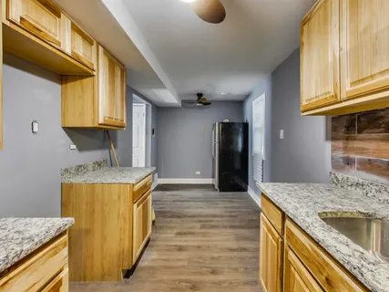 a kitchen with a stove and a sink