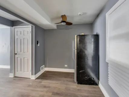 a view of a hallway to rooms