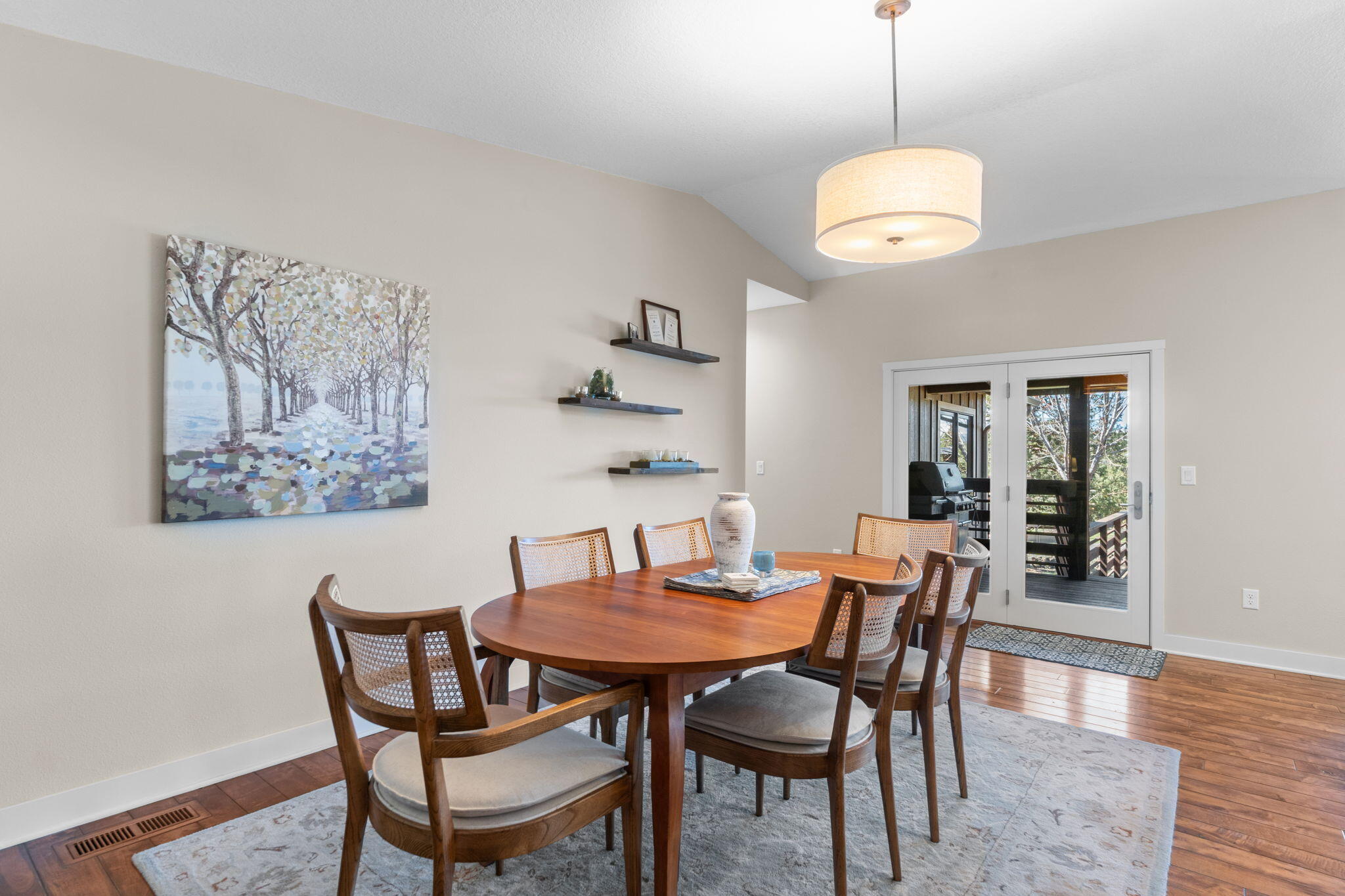19395 Innes Market Road Bend, OR 97703 - Photo 28 of 75 a view of a dining room with furniture and wooden floor