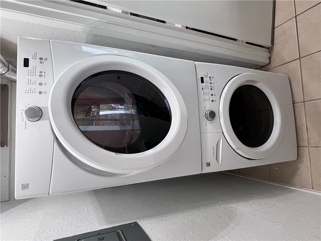 4507 Carter Creek Parkway, Unit 2 Bryan, TX 77802 - Photo 11 of 26 a utility room with dryer and washer
