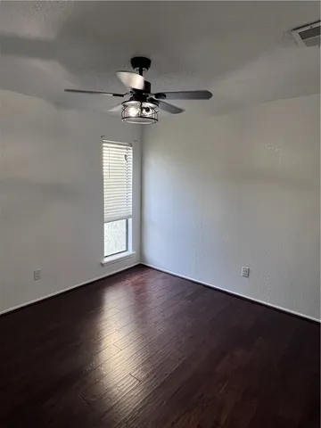 a view of walk in closet with wooden floor