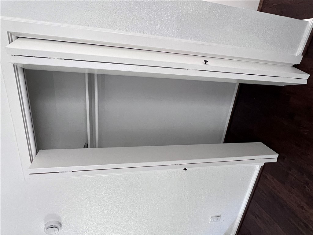 4507 Carter Creek Parkway, Unit 2 Bryan, TX 77802 - Photo 17 of 26 a view of walk in closet with wooden floor