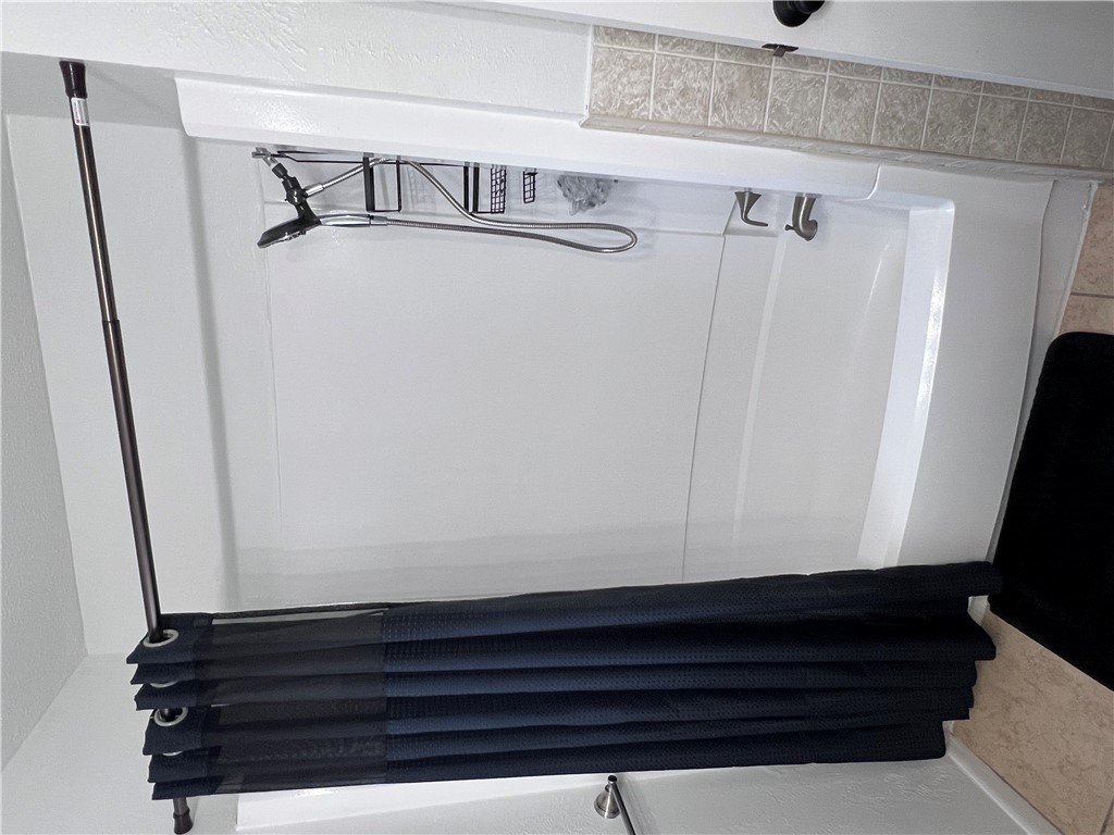 4507 Carter Creek Parkway, Unit 2 Bryan, TX 77802 - Photo 19 of 26 a bathroom with a shower and a shower